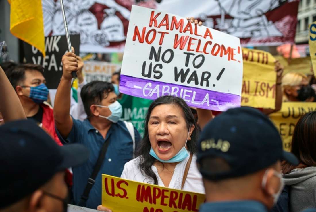 Filipino protesters carry placards and shout slogans during a demonstration against the visit of US Vice President Kamala Harris in Manila on Nov. 21, 2022