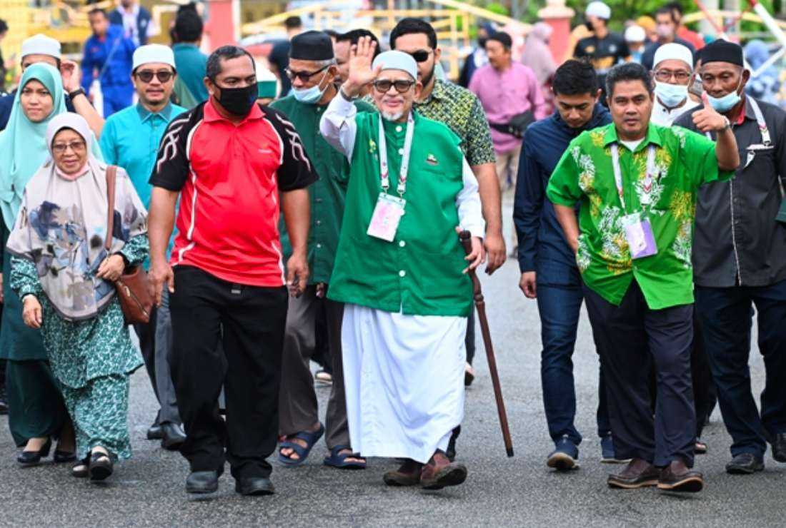 This handout photo shows Abdul Hadi Awang (center), the president of The Malaysian Islamic Party (PAS) waving during the general election in Marang, Malaysia's Terengganu state on Nov. 19, 2022