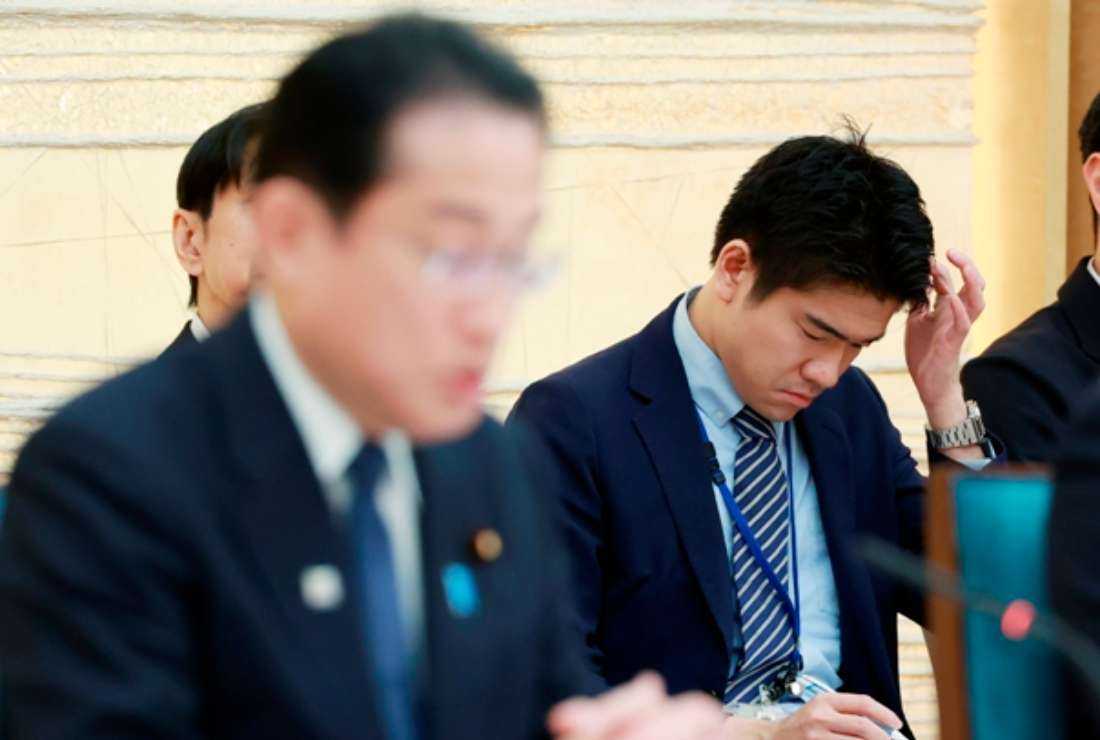 Shotaro Kishida (right), son of Japan's Prime Minister Fumio Kishida (left), attending a meeting at the prime minister's office on May 15. Kishida said on May 29 he will remove his son from the position of his secretary due to 'inappropriate behavior' at the official residence