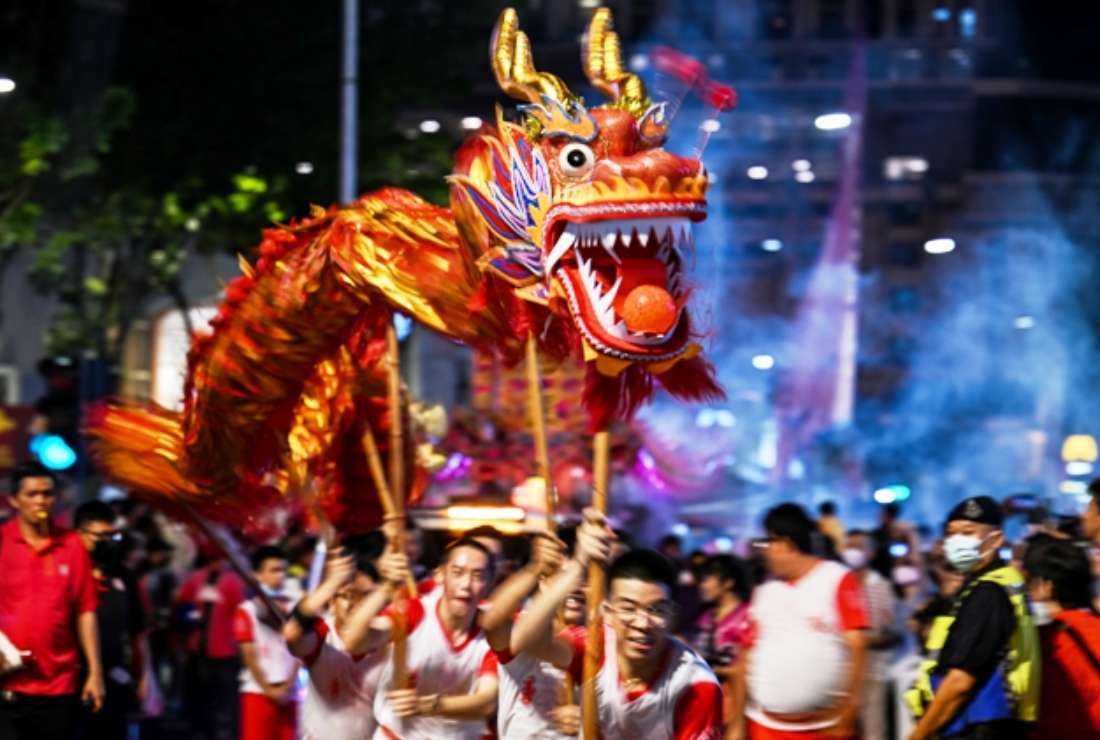Malaysian dragon dance performers make their way during the Chingay Parade in George Town on Penang Island on March 11. The Southeast Asian nation has several restrictions when it comes to Islamic matters, which impact the economy, both nationally and internationally