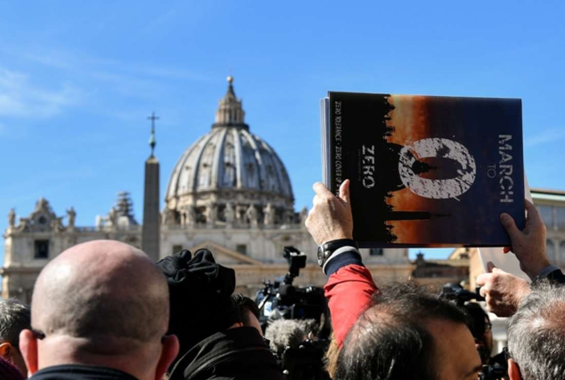 Members of Ending Clergy Abuse (ECA), a global organization of prominent survivors and activists stand for a protest by St. Peter's Basilica on Feb. 24, 2019