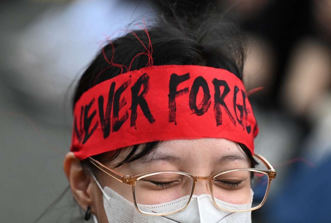 A protester wears a 'Never Forget' headband during a demonstration on the 50th anniversary of the imposition of martial law, at the University of the Philippines in Manila, on Sept. 21. (Photo: AFP)
