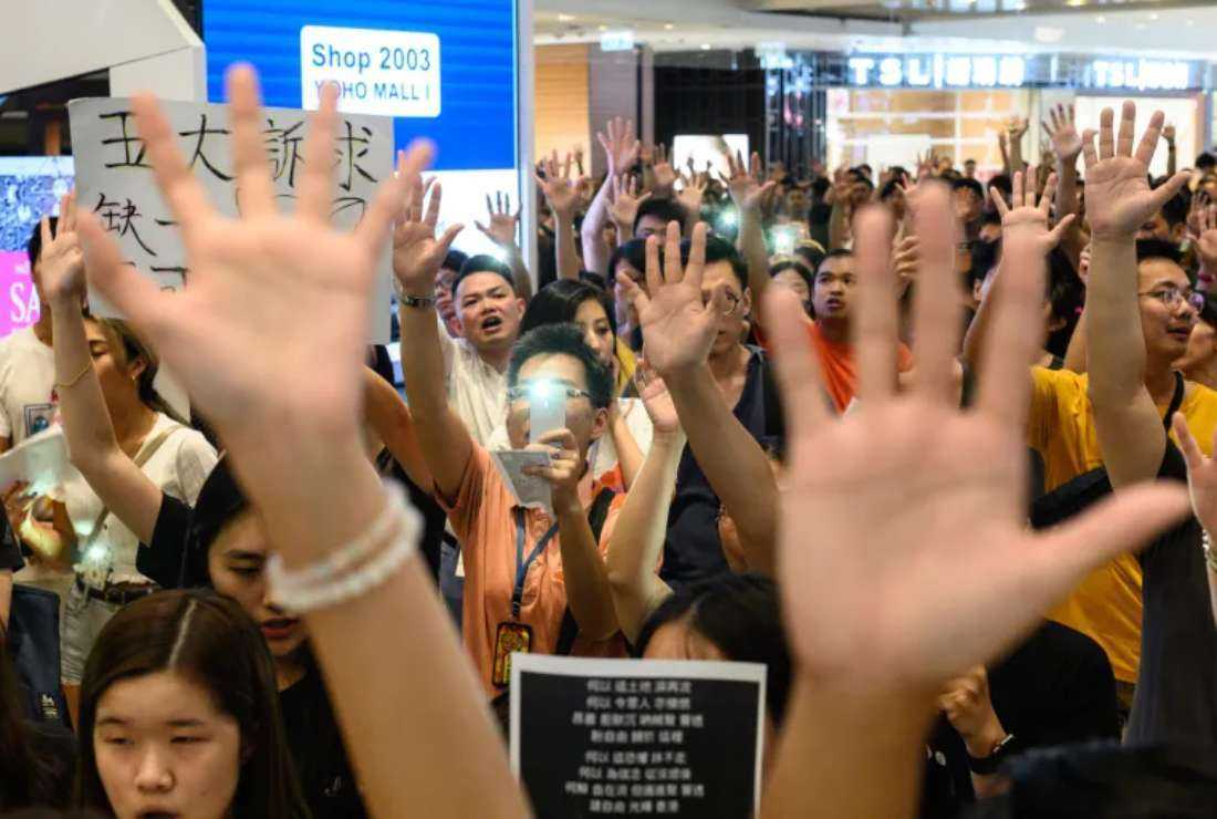 Pro-democracy protesters gather to sing 'Glory to Hong Kong' in a shopping mall in September 2019