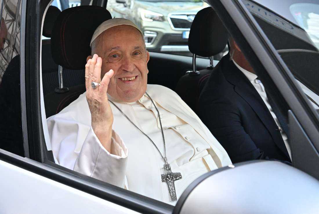 Pope Francis waves as he leaves after being discharged from the Gemelli hospital in Rome on June 16, 2023, where he underwent abdominal surgery last week