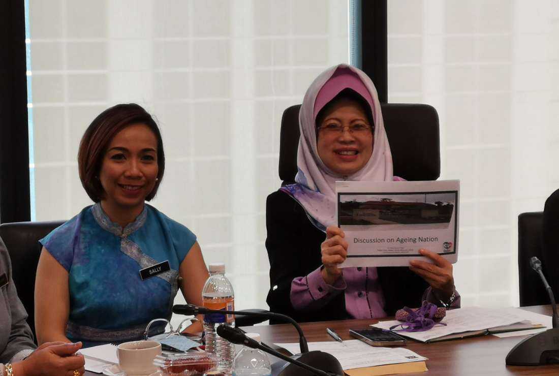 Fatimah Abdullah (right), the Minister of Women, Childhood and Community Wellbeing Development in Sarawak state of Malaysia speaks during a discussion on the elderly population in the state on Sept. 5, 2022