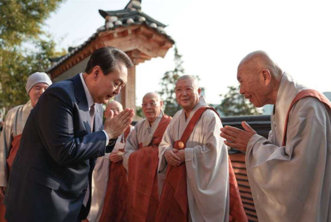 South Korean President Yoon Suk-yeol greets monks at Bongeun Temple in Seoul's southern district of Gangnam in 2022