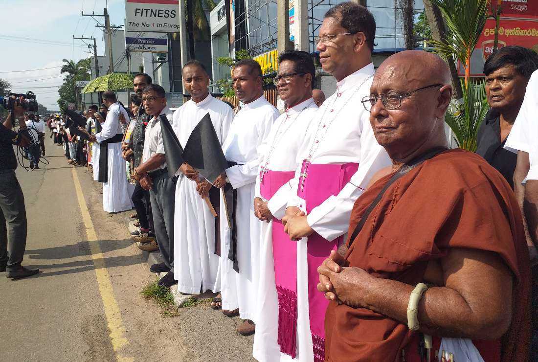Sri Lankan religious leaders join a 40-kilometer-long human chain to seek justice for victims of the 2019 Easter Sunday attacks in Colombo on April 21