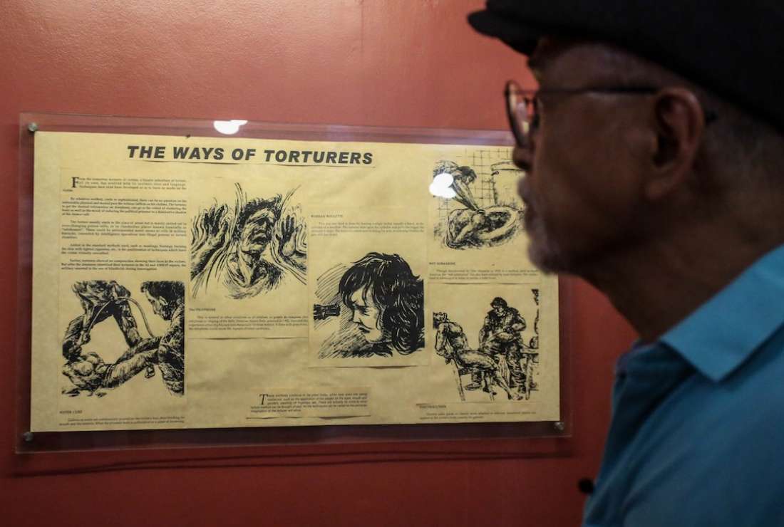 Former political prisoner Bonifacio Ilagan looks at a display about torture during the Philippines' martial law era at a museum in Quezon City, suburban Manila, on May 6